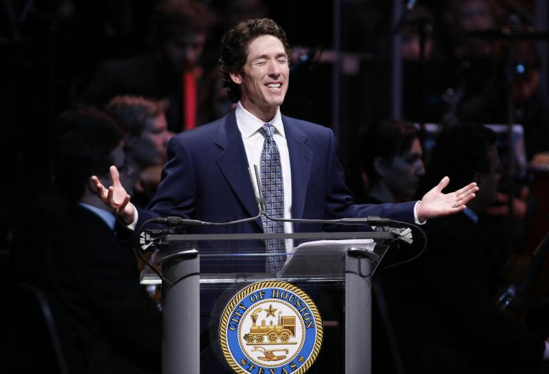 Joel Osteen gives the invocation before Annise Parker is publicly sworn in as mayor of Houston, Texas, January 2010.