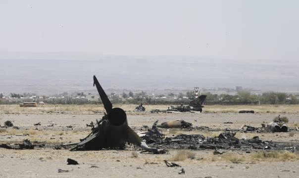 The wreckage of a Yemen air force fighter jet is seen after it was destroyed by Saudi bombing
