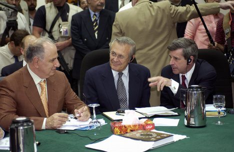 Ahmed_Chalabi_in_discussion_with_Paul_Bremer_and_Donald_Rumsfeld